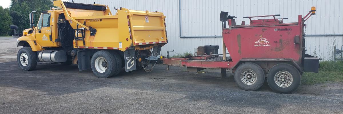 Township truck with tar trailer