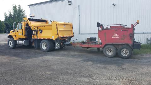 Township truck with tar trailer